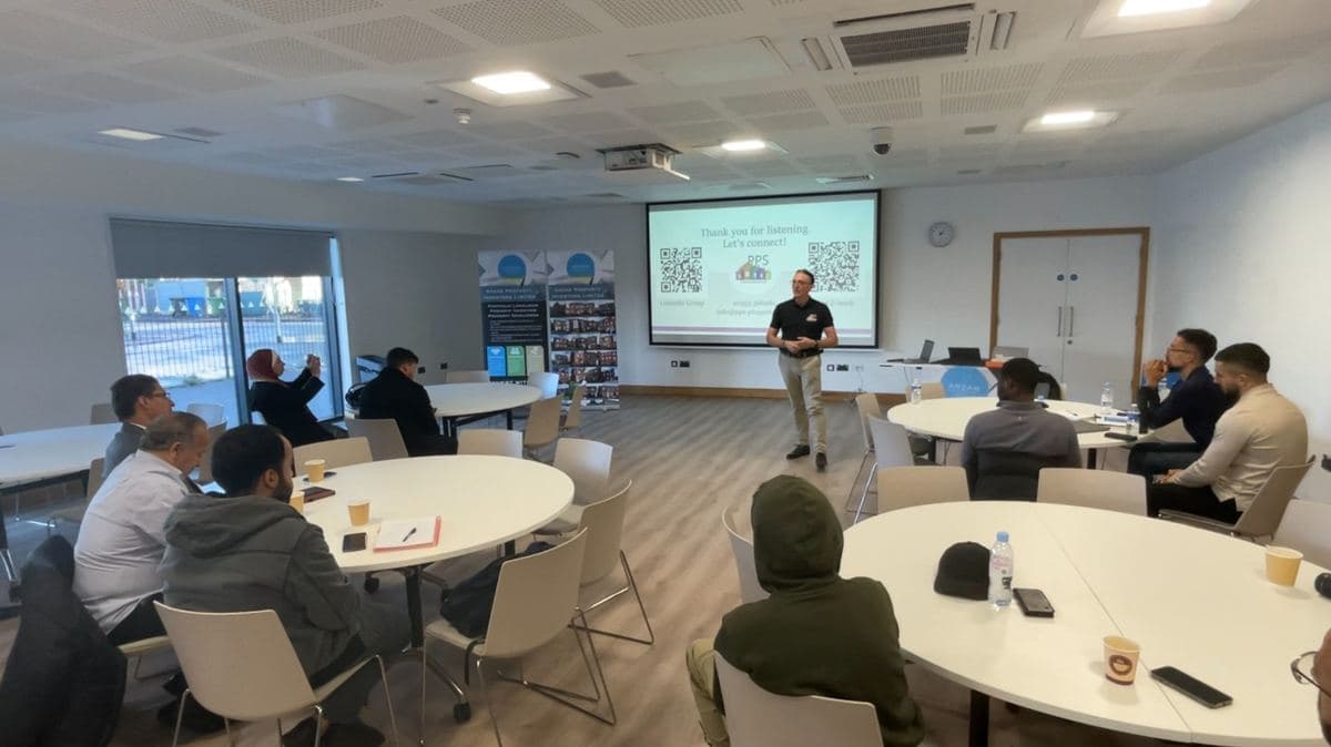 Steve Potter speaking to a room of business professionals at a property networking event